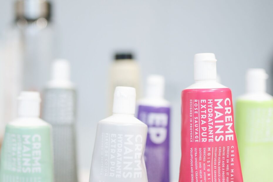 A variety of hand creams beautifully arranged on store shelves with focus on branding.
